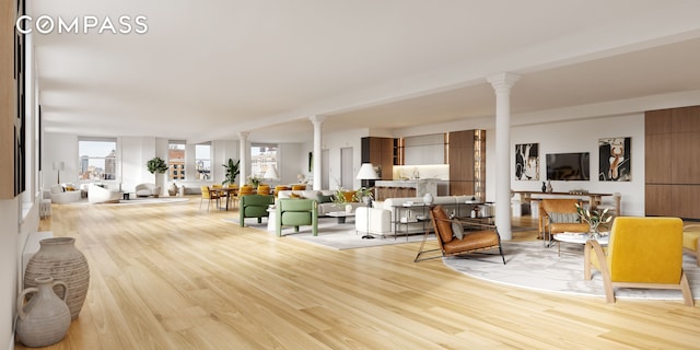 565 Broadway Unit 8, New York City, NY 10012 - living area with decorative columns, healthy amount of natural light, and light wood finished floors