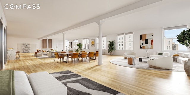 565 Broadway Unit 8, New York City, NY 10012 - living area with decorative columns, wood finished floors, and plenty of natural light