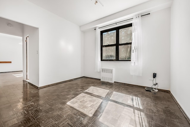 263 Bennett Ave Unit 1C, New York City, NY 10040 - unfurnished room featuring radiator heating unit and baseboards