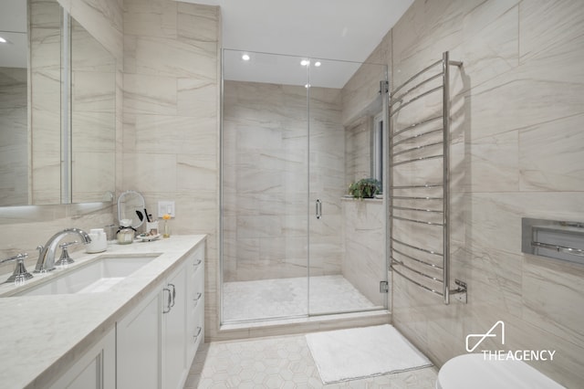 303 W 80th St Unit 2B1B, New York City, NY 10024 - full bath with vanity, a stall shower, tile walls, toilet, and recessed lighting