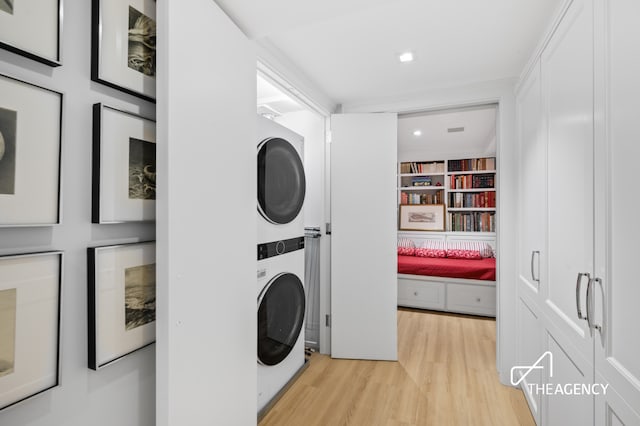 303 W 80th St Unit 2B1B, New York City, NY 10024 - laundry area with stacked washing machine and dryer, light wood-type flooring, and recessed lighting