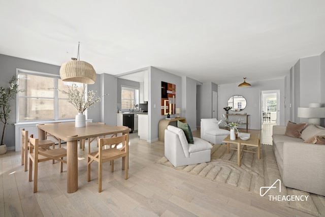 130 E 63rd St Unit 4E, New York City, NY 10065 - dining space featuring light wood-style floors and healthy amount of natural light