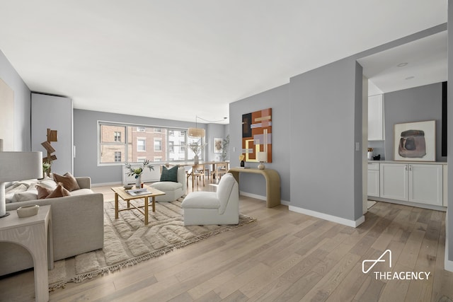130 E 63rd St Unit 4E, New York City, NY 10065 - living area with wood finished floors and baseboards