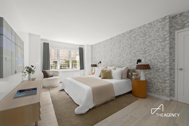 130 E 63rd St Unit 4E, New York City, NY 10065 - bedroom with light wood-style floors and wallpapered walls