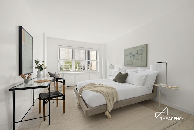 130 E 63rd St Unit 4E, New York City, NY 10065 - bedroom with light wood-style flooring