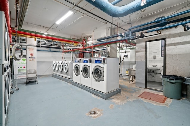 35-31 85th St Unit 8-L, New York City, NY 11372 - basement featuring washing machine and clothes dryer and a sink