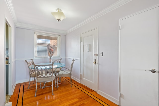 35-31 85th St Unit 8-L, New York City, NY 11372 - dining area featuring light wood-type flooring, ornamental molding, and baseboards