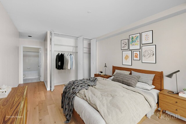 1400 5th Ave Unit 4G, New York City, NY 10026 - bedroom featuring a closet, light wood-style flooring, and ensuite bath