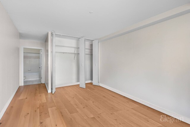 1400 5th Ave Unit 4G, New York City, NY 10026 - unfurnished bedroom with light wood-type flooring, baseboards, and a closet