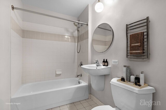 1400 5th Ave Unit 4G, New York City, NY 10026 - full bath with radiator heating unit, toilet, shower / bathtub combination, tile patterned floors, and a towel warming rack