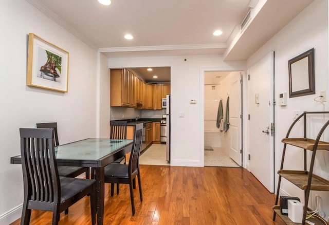 111 W 113th St Unit 4B, New York City, NY 10026 - dining space with ornamental molding, light wood-type flooring, and recessed lighting