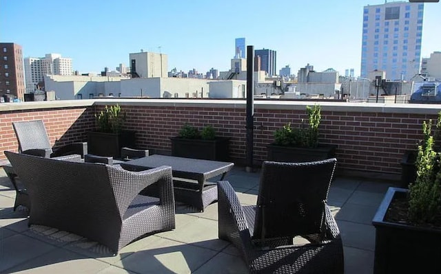 111 W 113th St Unit 4B, New York City, NY 10026 - view of patio / terrace featuring a view of skyline and outdoor dining space