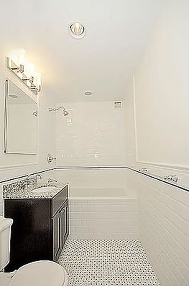 111 W 113th St Unit 4B, New York City, NY 10026 - full bath featuring vanity, tile patterned flooring, and a tub