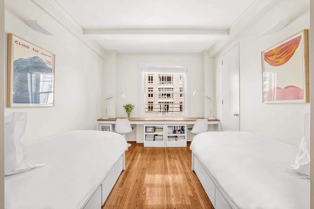 25 E End Ave Unit 10E, New York City, NY 10075 - bedroom featuring light wood-type flooring, beam ceiling, and crown molding