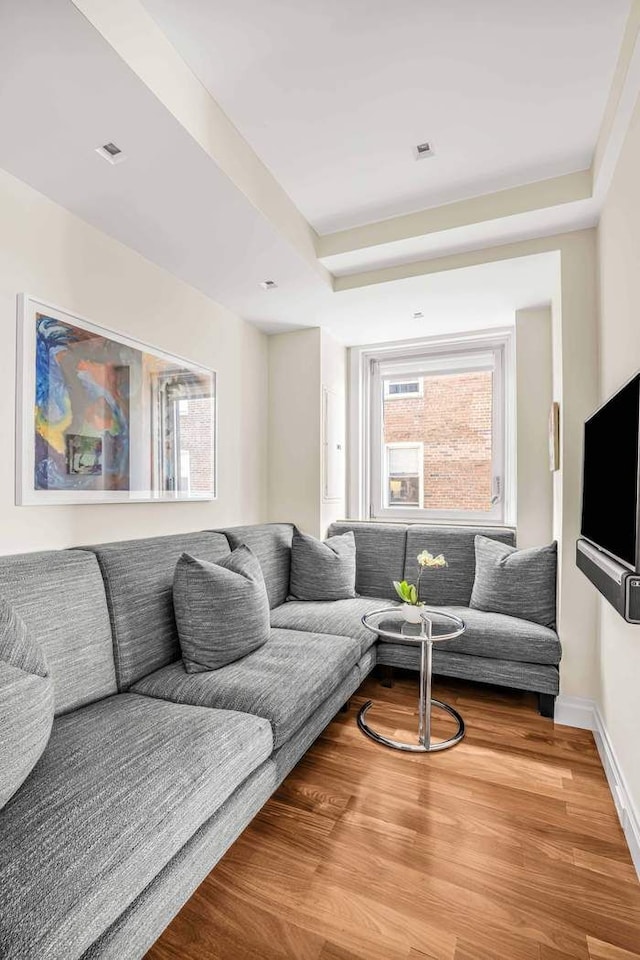 25 E End Ave Unit 10E, New York City, NY 10075 - living area with a raised ceiling, wood finished floors, and baseboards
