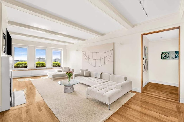 25 E End Ave Unit 10E, New York City, NY 10075 - living area with beamed ceiling, baseboards, light wood finished floors, and ornamental molding