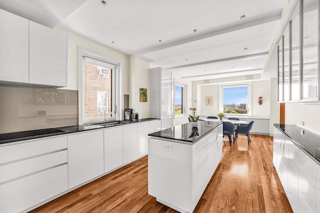 25 E End Ave Unit 10E, New York City, NY 10075 - kitchen with modern cabinets, a sink, and light wood finished floors
