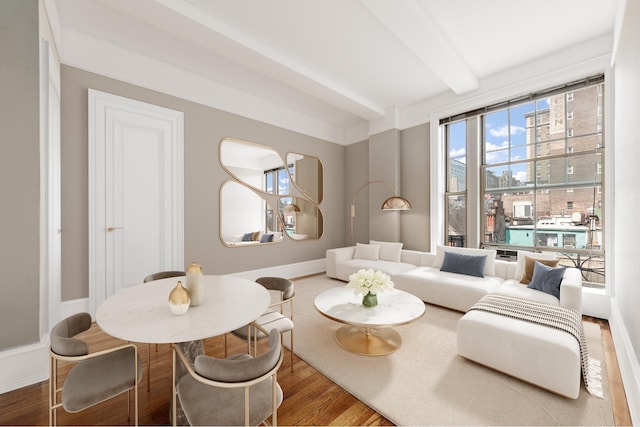170 W 74th St Unit 505, New York City, NY 10023 - living area with beamed ceiling, wood finished floors, and a city view