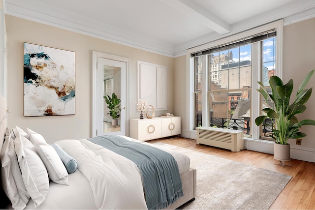 170 W 74th St Unit 505, New York City, NY 10023 - bedroom with beam ceiling and wood finished floors