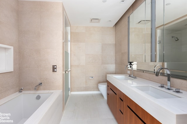 1 W End Ave Unit 18H, New York City, NY 10023 - full bathroom featuring double vanity, a bath, a stall shower, toilet, and tile walls