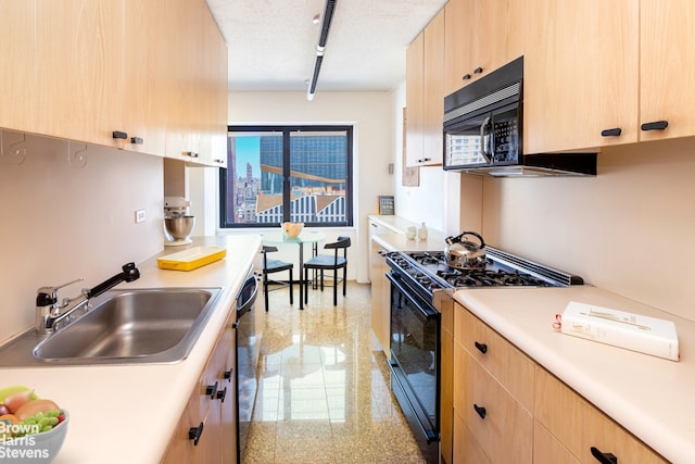 20 W 64th St Unit 20K, New York City, NY 10023 - kitchen with light brown cabinetry, black appliances, a sink, and granite floors