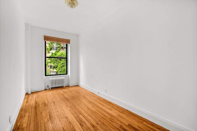 26 W 97th St Unit 3A, New York City, NY 10025 - empty room featuring radiator, light wood-style flooring, and baseboards