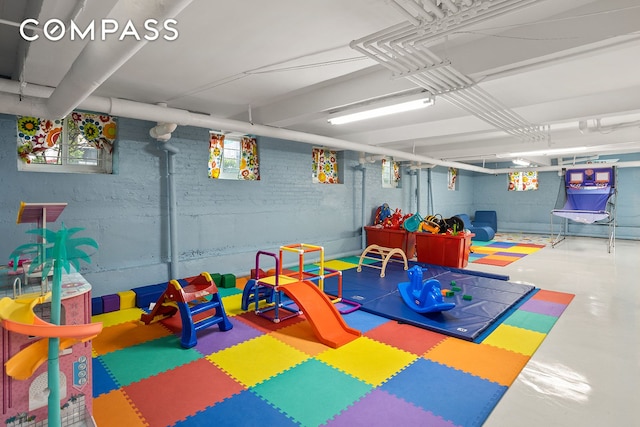 72-17 34th Ave Unit 1P, New York City, NY 11372 - playroom with finished concrete flooring