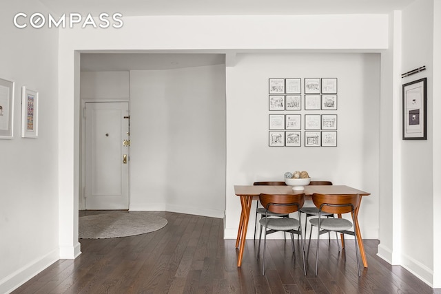 72-17 34th Ave Unit 1P, New York City, NY 11372 - dining space featuring dark wood-style floors and baseboards