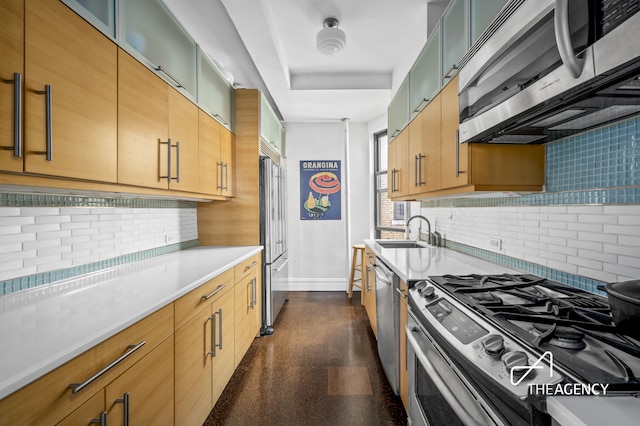 55 W 95th St Unit 94, New York City, NY 10025 - kitchen with appliances with stainless steel finishes, baseboards, a sink, backsplash, and light countertops