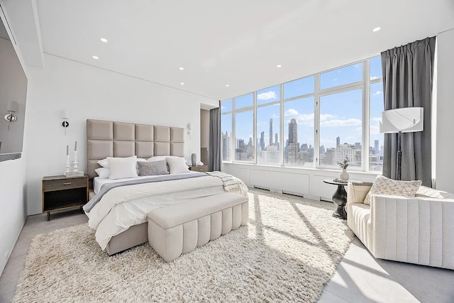 422 E 72nd St Unit 37Ad, New York City, NY 10021 - bedroom with a view of skyline and recessed lighting