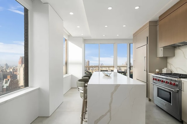 422 E 72nd St Unit 37Ad, New York City, NY 10021 - kitchen with premium appliances, modern cabinets, a center island, concrete flooring, and recessed lighting