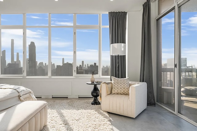 422 E 72nd St Unit 37Ad, New York City, NY 10021 - bedroom with finished concrete flooring and a skyline view