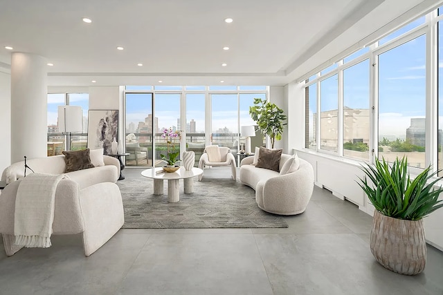 422 E 72nd St Unit 37Ad, New York City, NY 10021 - living room featuring finished concrete flooring, a skyline view, and recessed lighting