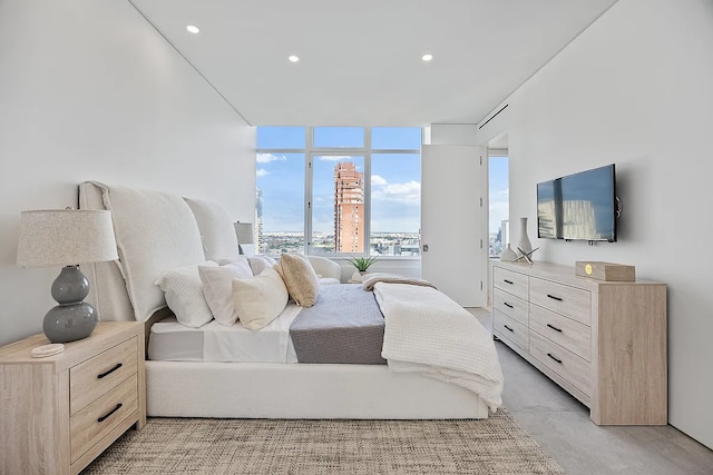 422 E 72nd St Unit 37Ad, New York City, NY 10021 - bedroom with expansive windows and recessed lighting