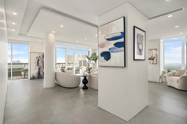 422 E 72nd St Unit 37Ad, New York City, NY 10021 - corridor featuring recessed lighting, a wall of windows, and concrete floors