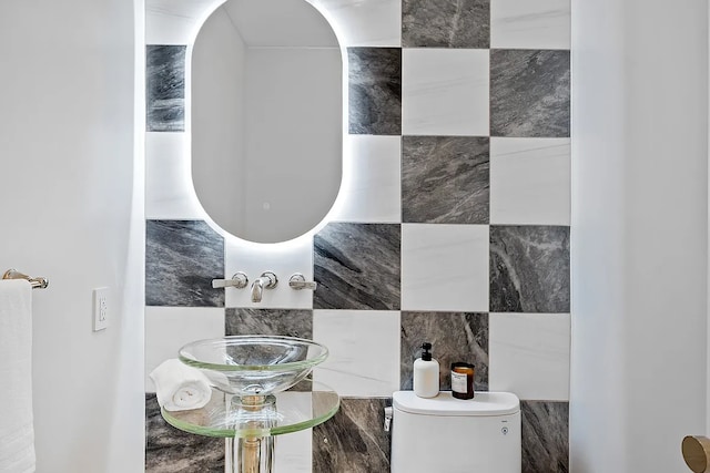 422 E 72nd St Unit 37Ad, New York City, NY 10021 - half bathroom with toilet and tile walls