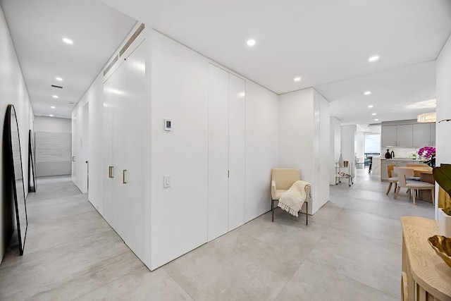 422 E 72nd St Unit 37Ad, New York City, NY 10021 - corridor with recessed lighting and concrete flooring