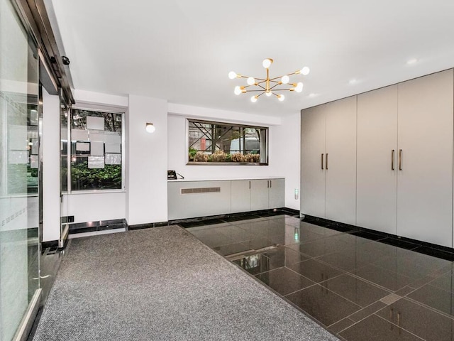333 E 66th St Unit 12-C, New York City, NY 10065 - foyer with granite tiled floors, a chandelier, recessed lighting, and radiator heating unit