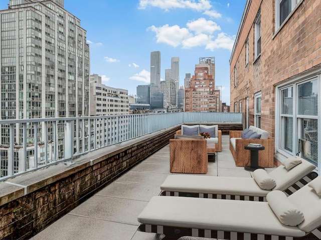333 E 66th St Unit 12-C, New York City, NY 10065 - view of patio with an outdoor living space and a skyline view