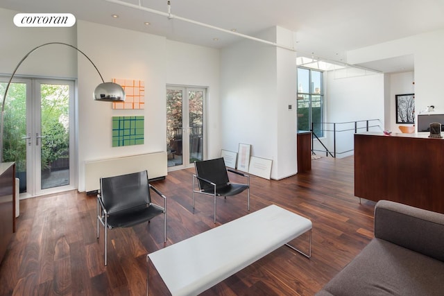 345 W 13th St Unit Ph6B, New York City, NY 10014 - living area with french doors, healthy amount of natural light, and wood finished floors