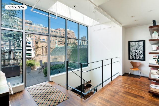 345 W 13th St Unit Ph6B, New York City, NY 10014 - hall featuring wood finished floors, a view of city, plenty of natural light, and floor to ceiling windows