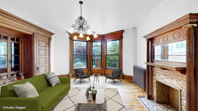 93A Rutland Rd, New York City, NY 11225 - living area featuring a chandelier, plenty of natural light, and light wood-style flooring