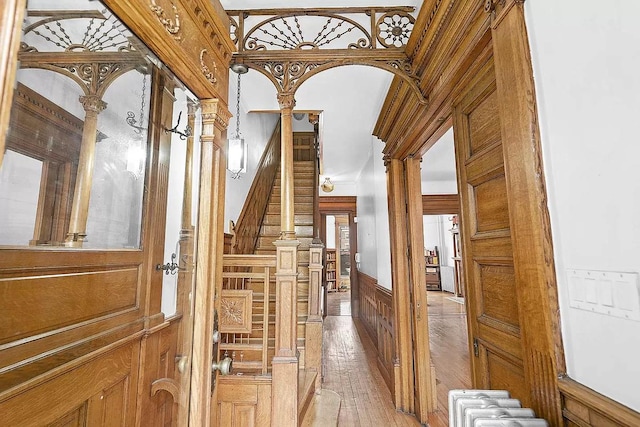 93A Rutland Rd, New York City, NY 11225 - hallway with hardwood / wood-style flooring, wainscoting, and stairway