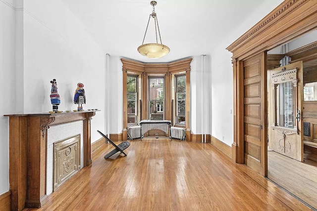 93A Rutland Rd, New York City, NY 11225 - foyer entrance with wood finished floors and radiator heating unit