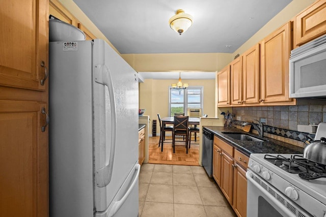 5500 Fieldston Rd Unit 7Ee, New York City, NY 10471 - kitchen featuring white appliances, a sink, backsplash, a chandelier, and light tile patterned flooring