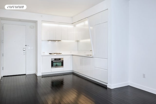 123 Washington St Unit 35E, New York City, NY 10006 - kitchen with modern cabinets, oven, white cabinetry, light countertops, and baseboards