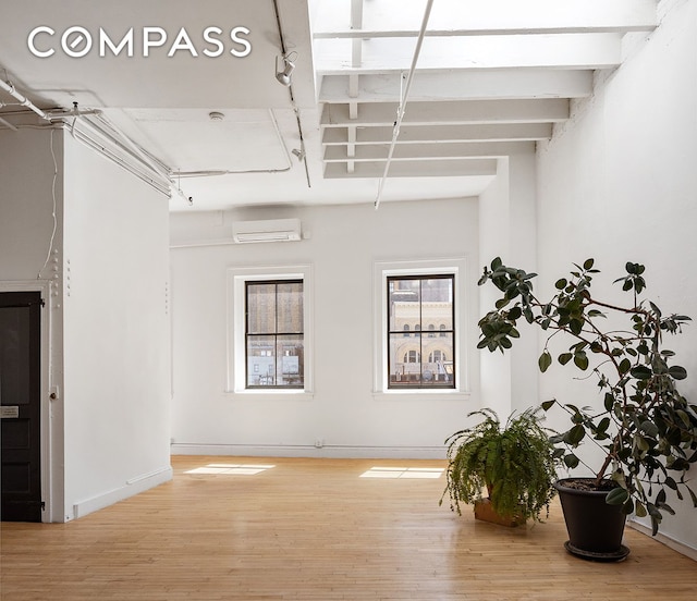 47 Howard St Unit 5, New York City, NY 10013 - empty room featuring an AC wall unit and wood finished floors