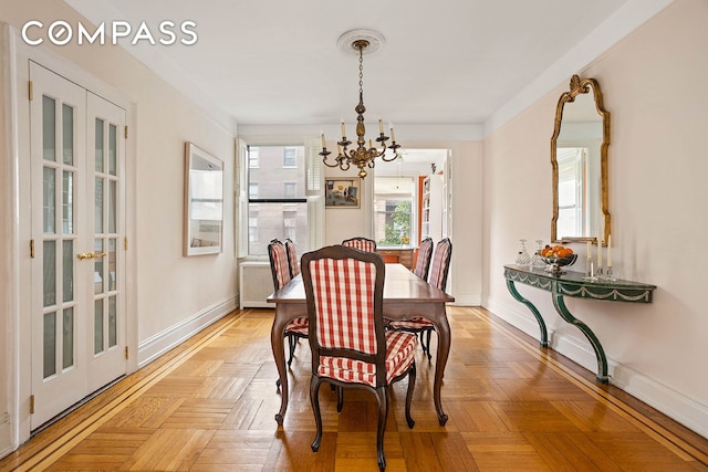 37-28 80th St Unit 32, New York City, NY 11372 - dining space with a chandelier and baseboards