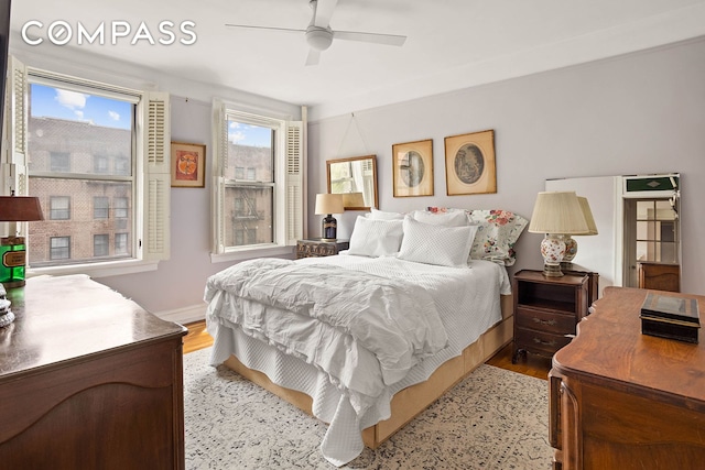 37-28 80th St Unit 32, New York City, NY 11372 - bedroom featuring wood finished floors and ceiling fan