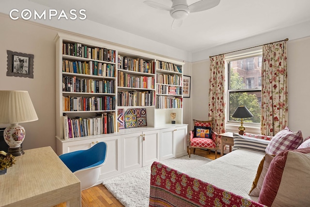 37-28 80th St Unit 32, New York City, NY 11372 - living area with ceiling fan and light wood finished floors